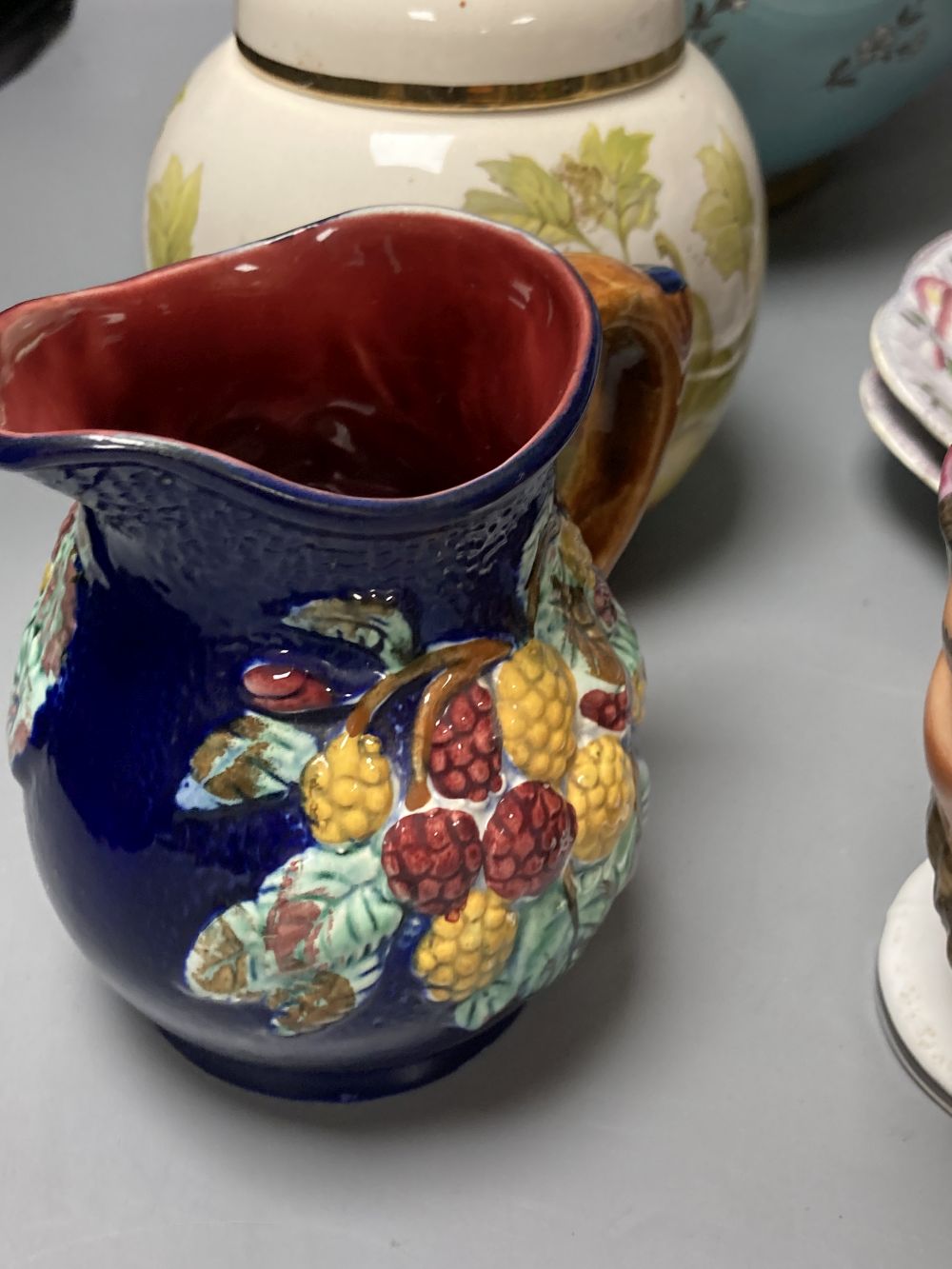 A 19th century pearlware Bacchus mask jug, a pair of Victorian pink opaline glass ewers and sundry items